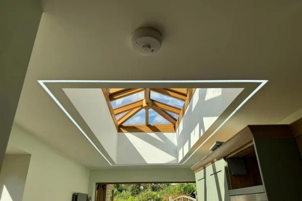 A recesssed ceiling window with an LED strip around the aperture.